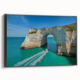 Framed canvas artwork displaying a scenic landscape of dramatic cliffs, featuring rich colors and intricate detailing, presented in a sleek black frame for an elegant touch.