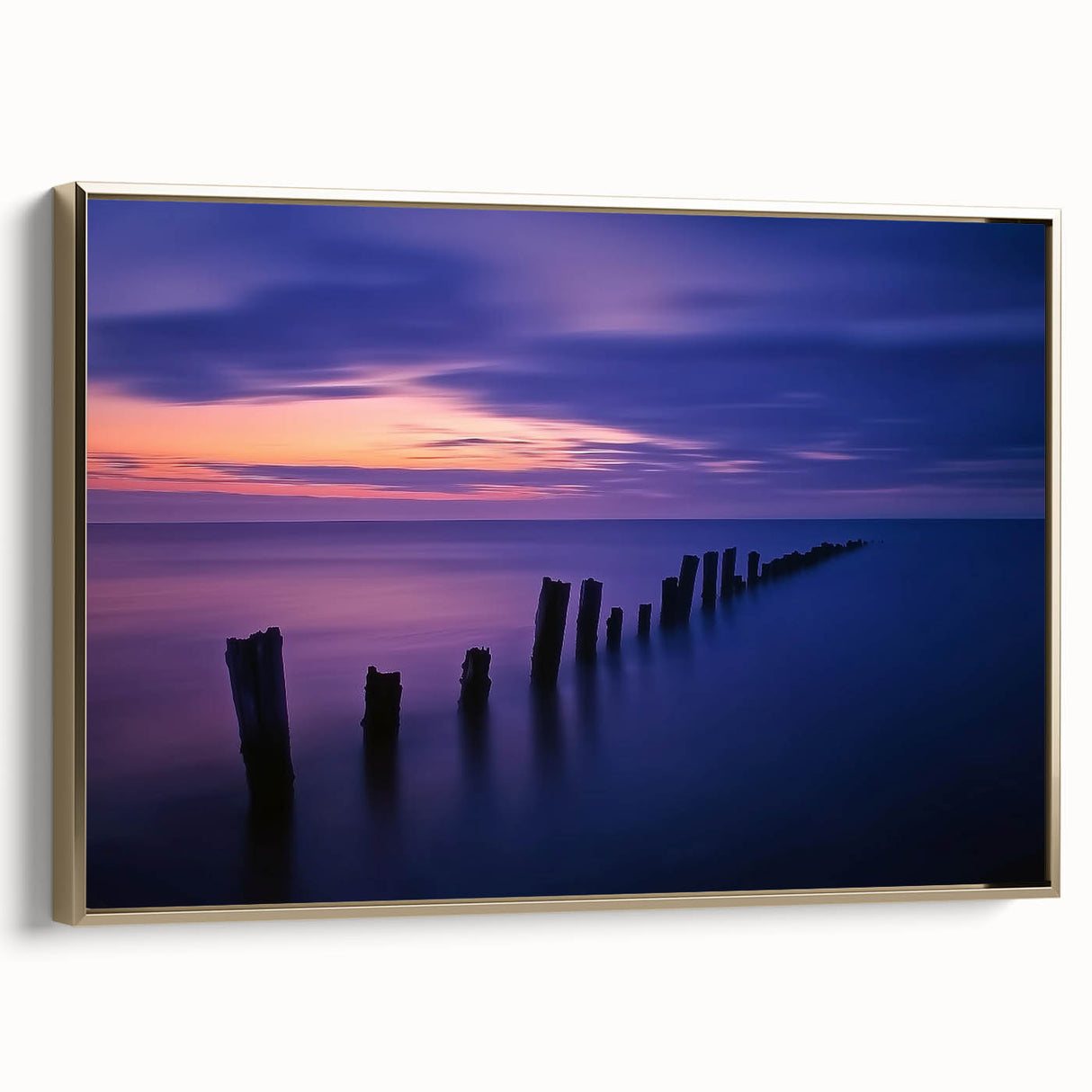 Framed canvas artwork showcasing a stunning beach landscape with vibrant colors and a gold frame, perfect for enhancing home decor and creating a serene atmosphere.