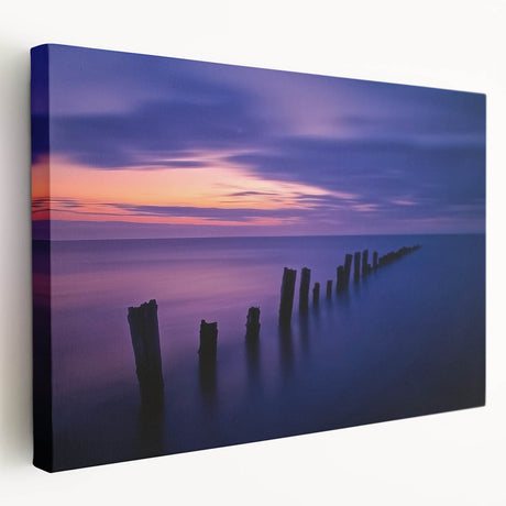 Stretched canvas artwork showcasing a vibrant beach landscape, featuring vivid blue skies and golden sands, ideal for coastal-themed home decor.