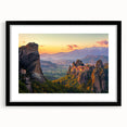 Black-framed landscape artwork featuring a picturesque countryside scene with a white mat, designed to enhance home decor and evoke tranquility.