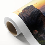 Rolled canvas showcasing a picturesque countryside landscape design, featuring vibrant greens and soft blues, beautifully packaged in a protective cardboard tube for easy display and transport.