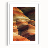Framed landscape artwork depicting a serene desert scene, featuring warm sandy tones and a white mat, ideal for home decor or office settings.