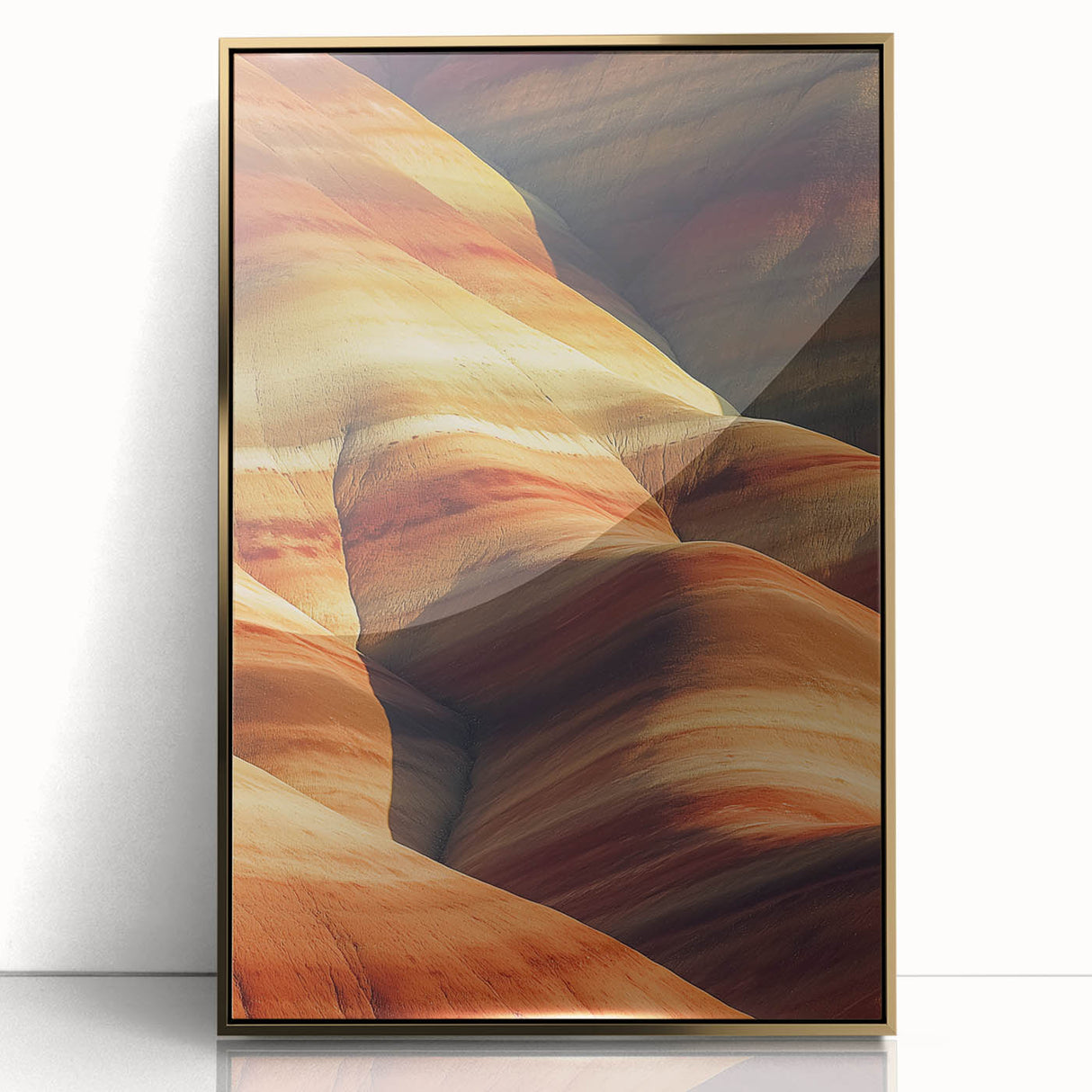 Framed acrylic artwork showcasing a desert landscape with warm golden tones, elegantly displayed in a sleek gold frame, perfect for home decor.