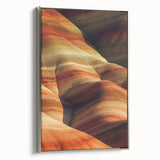 Framed canvas artwork titled "Design 100 Landscapes: Desert" showcasing a serene desert landscape in warm hues, accented by a sleek silver frame, ideal for home decor.