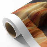 Vibrant rolled canvas showcasing a stunning desert landscape design in warm earth tones, elegantly packaged in a protective cardboard tube for easy shipping and display.