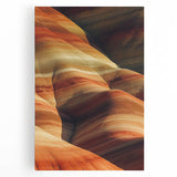 Desert landscape stretched canvas print showcasing vibrant hues of orange and yellow, depicting a serene sunset over sand dunes, ideal for home decor.