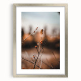 Textured art depicting abstract autumnal hues on a framed silver mat, ideal for bedroom ambiance.