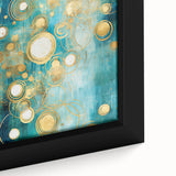 Close-up of a framed canvas wall art featuring abstract strokes in vibrant hues of blue, orange, and yellow, adding a modern artistic touch to home decor.