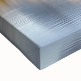 Close-up of a stretched canvas artwork depicting a picturesque landscape with a majestic castle, showcasing vibrant colors and fine details, perfect for home decor.