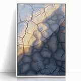 Framed acrylic artwork depicting a dramatic cliffside landscape with vibrant colors and intricate details, elegantly displayed against a white background.