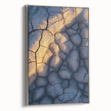 Framed canvas depicting a scenic landscape with dramatic cliffs and vibrant colors, showcasing a sleek silver frame that enhances the artwork's elegance. Perfect for modern home decor.