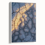 Framed canvas artwork depicting a stunning landscape of cliffs with vibrant colors and intricate details, showcasing natural beauty in a white frame from a side view.