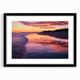 Framed landscape artwork showcasing serene beach scenery, with a black mat and sleek frame, ideal for enhancing modern home decor and coastal themes.