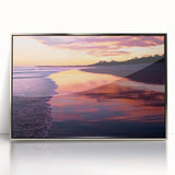 Framed acrylic artwork showcasing a serene beach landscape with soft waves and golden sands, elegantly presented in a sleek silver frame, ideal for home decor.