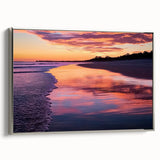 Framed canvas artwork showcasing a serene beach landscape, featuring soft pastel colors and a silver frame, ideal for enhancing coastal-themed interiors. Perfect for living rooms or beach houses.