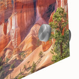 Close-up view of a vibrant acrylic landscape artwork depicting colorful canyons, showcasing intricate details and textures, perfect for home decor inspiration.