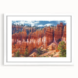 Framed landscape artwork showcasing vibrant canyons with a white mat, perfect for home decor, adding depth and color to any interior space.