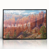 Framed acrylic landscape artwork showcasing vibrant canyons with rich colors and intricate details, set in a sleek black frame, ideal for modern home decor.