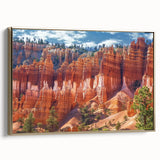 Framed canvas art showcasing a stunning landscape of canyons, featuring rich earthy tones and intricate details, with a gold frame adding elegance, perfect for home decor.