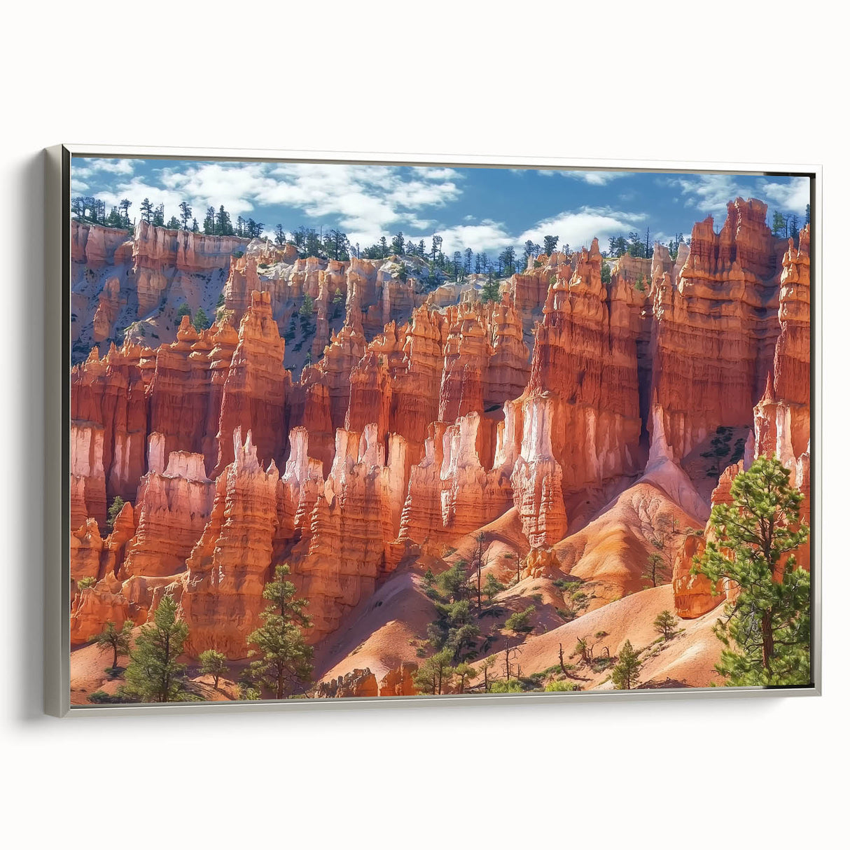 Framed canvas artwork showcasing a stunning landscape of canyons, elegantly bordered in silver, ideal for enhancing modern home decor with natural beauty.