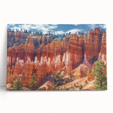 Stretched canvas artwork showcasing a vibrant landscape of canyons, featuring rich earthy tones and dramatic rock formations, perfect for modern home decor.