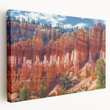 Stretched canvas artwork depicting a vibrant landscape of canyons in rich hues of orange and red, showcasing textured details that enhance depth and visual interest, perfect for modern home decor.