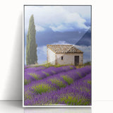 Framed acrylic landscape art depicting a serene countryside scene with vibrant green fields and a clear blue sky, presented in a sleek white frame for modern decor.