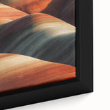 Close-up of a framed desert landscape canvas print showcasing warm earth tones, intricate details, and a textured surface, ideal for enhancing home decor.