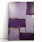 Abstract wall art featuring vibrant strokes in shades of blue, orange, and yellow on a stretched canvas, leaning against a neutral wall, perfect for modern decor.