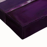 Close-up of an abstract strokes wall art piece featuring vibrant blue, yellow, and red hues on stretched canvas, adding a contemporary touch to any decor.