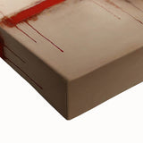 Close-up view of a stretched canvas featuring vibrant abstract strokes in shades of blue, orange, and yellow, ideal for modern home decor or art enthusiasts.