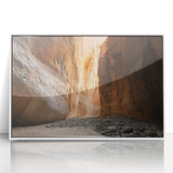 Framed acrylic artwork depicting a stunning landscape with intricate cave formations, featuring a white frame that enhances the vibrant colors and details. Ideal for home decor.