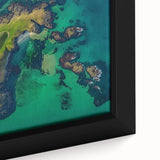 Close-up of a framed canvas artwork depicting dramatic cliffs and vibrant landscapes, showcasing rich colors and intricate details, ideal for modern home decor.