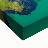 Close-up of a stretched canvas artwork depicting dramatic cliffs in a vibrant landscape, showcasing rich colors and intricate details that enhance any decor.