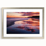 Elegant silver-framed landscape artwork depicting serene beaches and vibrant skies, featuring a white mat for added depth, ideal for coastal-themed decor.