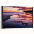 Framed canvas artwork depicting a serene beach landscape, showcasing vibrant colors and details, with a sleek black frame enhancing its modern aesthetic. Perfect for coastal decor enthusiasts.