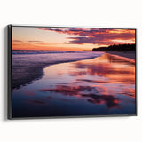 Framed canvas artwork depicting a serene beach landscape, showcasing vibrant colors and details, with a sleek black frame enhancing its modern aesthetic. Perfect for coastal decor enthusiasts.