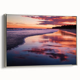 Framed landscape canvas artwork depicting a serene beach scene with vibrant colors and silver framing, ideal for home decor and coastal-themed interiors.