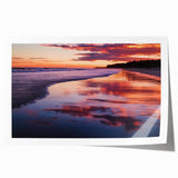 Stunning rolled print of a tranquil beach landscape, showcasing soft sand and gentle waves under a vibrant sunset sky, ideal for home decor or art collections.