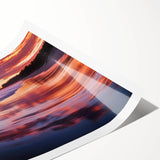 Stunning landscape print showcasing a serene beach scene with soft waves and golden sand, rolled for easy transport and display in a protective cardboard tube.