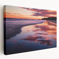 Stretched canvas artwork displaying a vibrant beach landscape, showcasing bright blue skies, golden sands, and lush palm trees, ideal for coastal-themed decor.