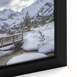 Close-up of a beautifully framed landscape canvas print depicting a serene bridge over water, featuring vibrant colors and intricate details, perfect for home decor.