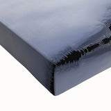 Close-up of a stretched canvas print depicting a serene landscape bridge scene, featuring vibrant colors and intricate details, perfect for home decor and enhancing any space.