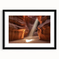 Black-framed landscape art print showcasing vibrant canyons in rich earth tones, with a white mat for added elegance, perfect for home decor enhancement.