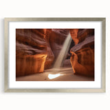 Landscape artwork of a canyon framed in a sleek silver frame with a mat, showcasing rich earthy tones and intricate details, perfect for home decor.