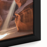 Framed canvas artwork depicting a vibrant desert canyon landscape with rich colors and intricate details, ideal for home decor and nature enthusiasts.