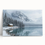 Stretched canvas artwork depicting a serene countryside landscape with vibrant green fields and a blue sky, leaning against a wooden wall for display.