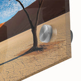 Close-up of a vibrant acrylic glass landscape artwork depicting a serene desert scene, showcasing warm hues of orange and yellow, perfect for modern home decor.