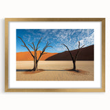 Desert landscape framed artwork in a gold mat, showcasing warm earthy tones and intricate details, perfect for enhancing home decor with a touch of elegance.