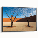 Framed canvas artwork depicting a vibrant desert landscape with warm colors, featuring a black frame and side view display, ideal for home decor.